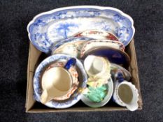 A box containing antique and later china to include blue and white turkey plates, wall plates,