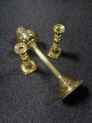 An antique brass Corinthian column oil lamp base and a pair of antique brass candlesticks