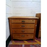 An antique pine four drawer chest