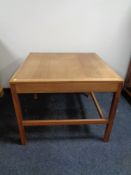 A mid 20th century Danish teak square coffee table.