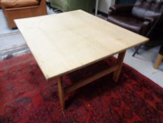 A 20th century blonde oak rectangular coffee table.