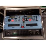 A DJ's flight case containing a QSC Powerlight 20 professional amplifier,