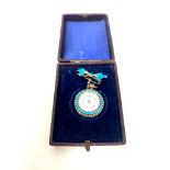 A lady's silver and enamel fob watch with bow brooch in case.