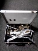 An aluminium case containing a set of Marke Tischfein cutlery.