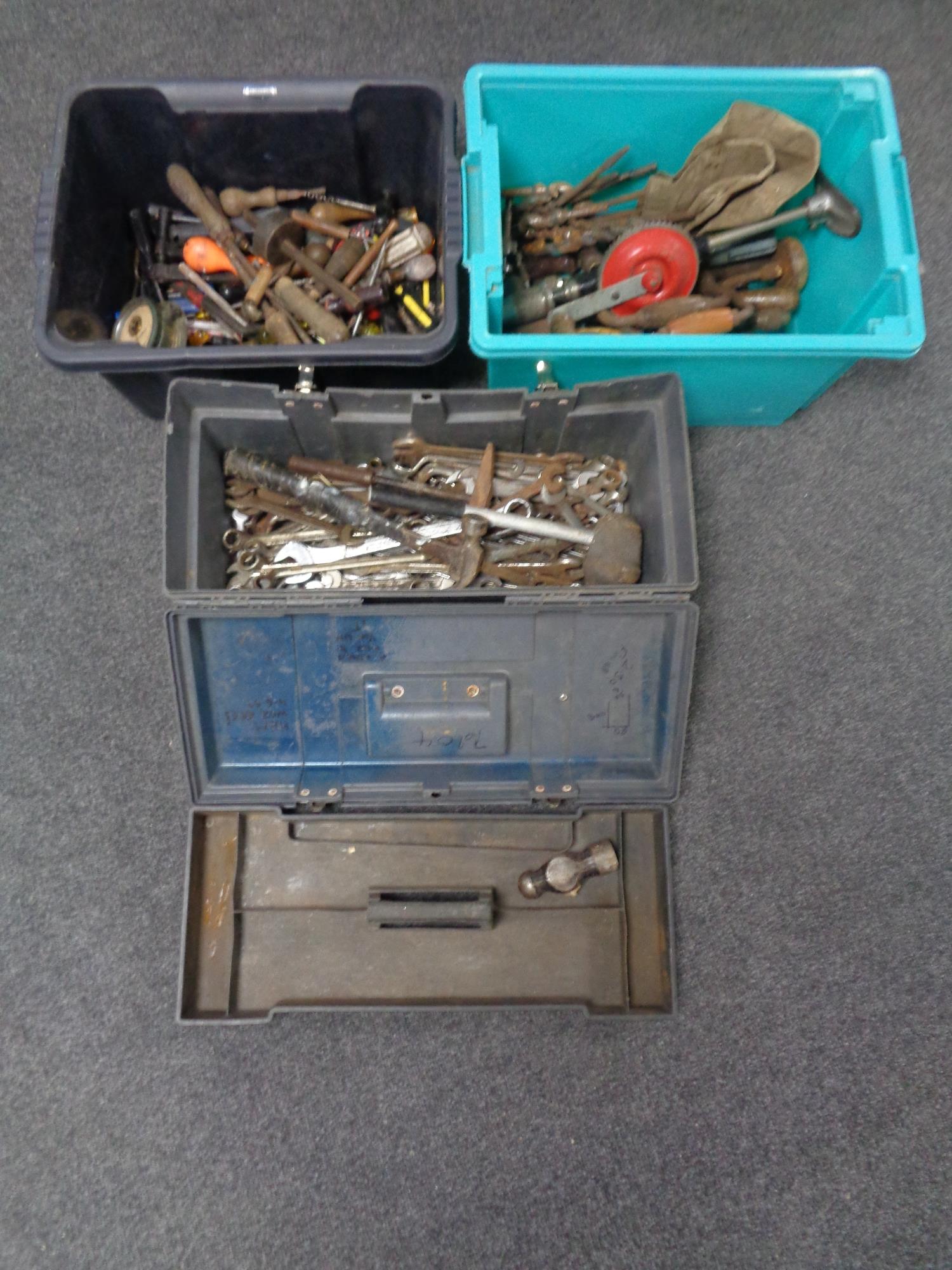 Two plastic crates containing a large quantity of assorted hand tools together with a tool box