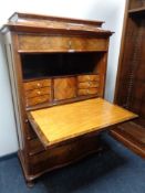 A 19th century mahogany and rosewood secretaire chest.
