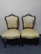 A pair of carved beech French salon chairs.