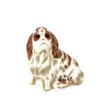 A Royal Crown Derby Cavalier King Charles Spaniel with gold stopper