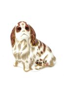 A Royal Crown Derby Cavalier King Charles Spaniel with gold stopper