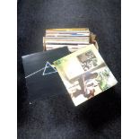 A box of vinyl LP records - Pink Floyd, Super Tramp, Steve Miller band,