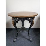 A cast iron Britannia bar table with copper top.