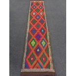 A Suzni kilim runner 300cm by 67cm