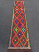 A Suzni kilim runner 300cm by 67cm