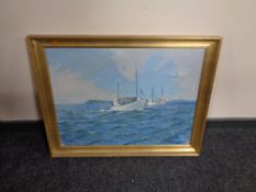 A gilt framed oil on canvas depicting fishing boats off a headland, indistinctly signed.