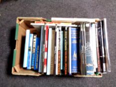 A box of hardback and paperback books relating to the Titanic