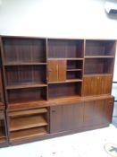 A mid 20th century Danish bureau bookcase, fitted cupboards and drawers beneath.