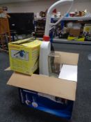 A boxed Bissell compact carpet cleaner together with a further boxed hand held steam cleaner and an