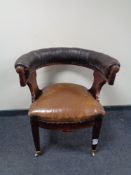 A 19th century mahogany button leather upholstered club armchair.