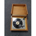 A mid 20th century Delphone turntable in a teak case.
