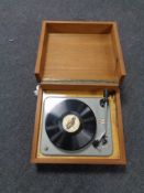 A mid 20th century Delphone turntable in a teak case.