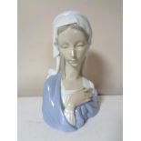 A Lladro figure of the Madonna.