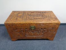 A carved camphorwood blanket box.