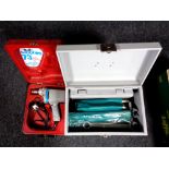 A metal box containing router bits, spanner set, socket set etc,