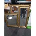 A gilt framed bevel edged hall mirror together with two further gilt framed mirrors.