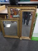 A gilt framed bevel edged hall mirror together with two further gilt framed mirrors.