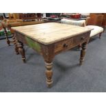 A 19th century pine kitchen table, fitted two drawers.