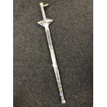 A good quality reproduction broad sword mounted in brass with scabbard, total length 117 cm.