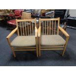 A pair of mid 20th century Danish beech spindle back armchairs by TSM.