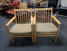 A pair of mid 20th century Danish beech spindle back armchairs by TSM.