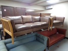 A 20th century Stouby wood framed brown leather three seater settee with matching two seater settee.