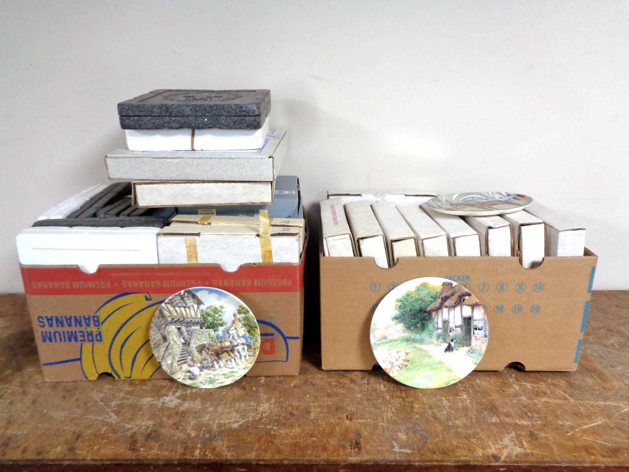 Two boxes containing a quantity of Poole, Spode, Wedgwood and Limoges collector's plates.