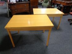 A pair of 20th century Danish beech turnover top coffee tables.
