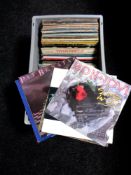 A box of vinyl LP's and 12" singles, Joan Baez, Stevie Wonder, Wings,