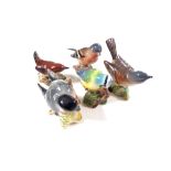 Nine Beswick bird ornaments to include bullfinch, blue tit, wren, green finch etc (as found).