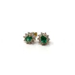 A pair of 18ct gold diamond and emerald cluster earrings (2)
