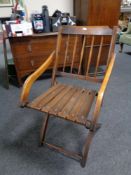 A 20th century spindle back cruise liner folding chair.