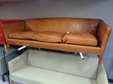 A 20th century continental brown leather three seater settee (a/f).