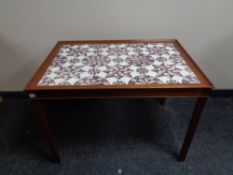 A mid 20th century tile topped coffee table.
