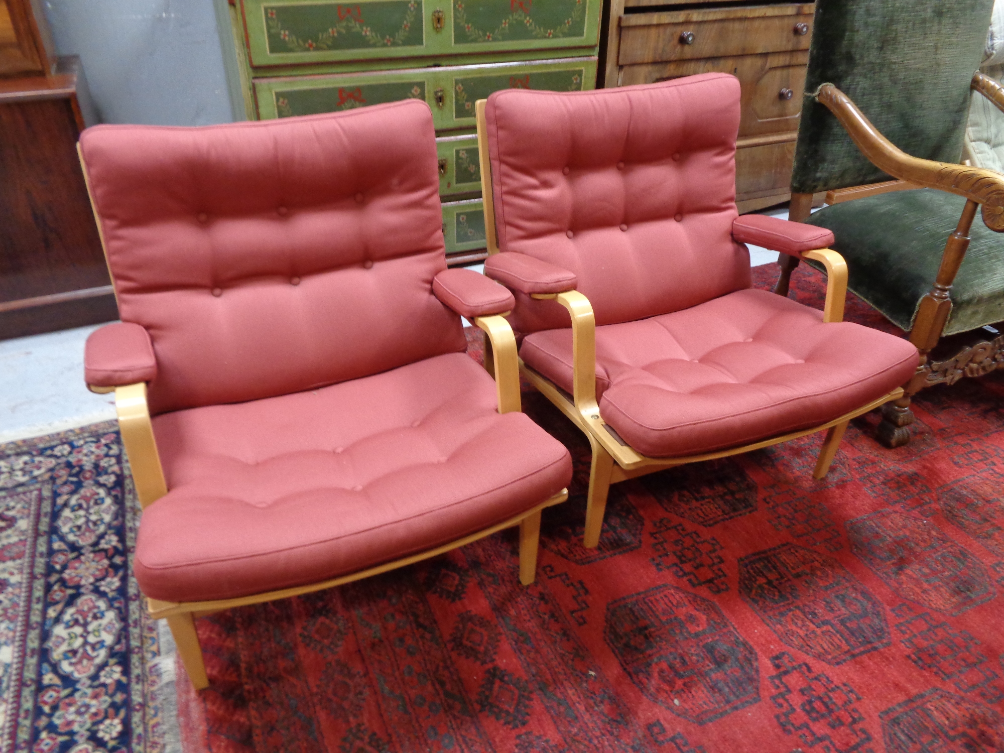 A pair of beech framed low-back armchairs by Bruno Mathsson for Dux.