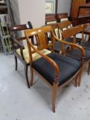 An early 20th century mahogany armchair together with a further armchair.