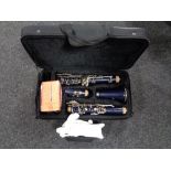 A four piece Slade clarinet in case with reeds and gloves