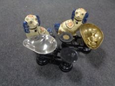 A pair of Staffordshire style dogs together with two sets of kitchen scales,