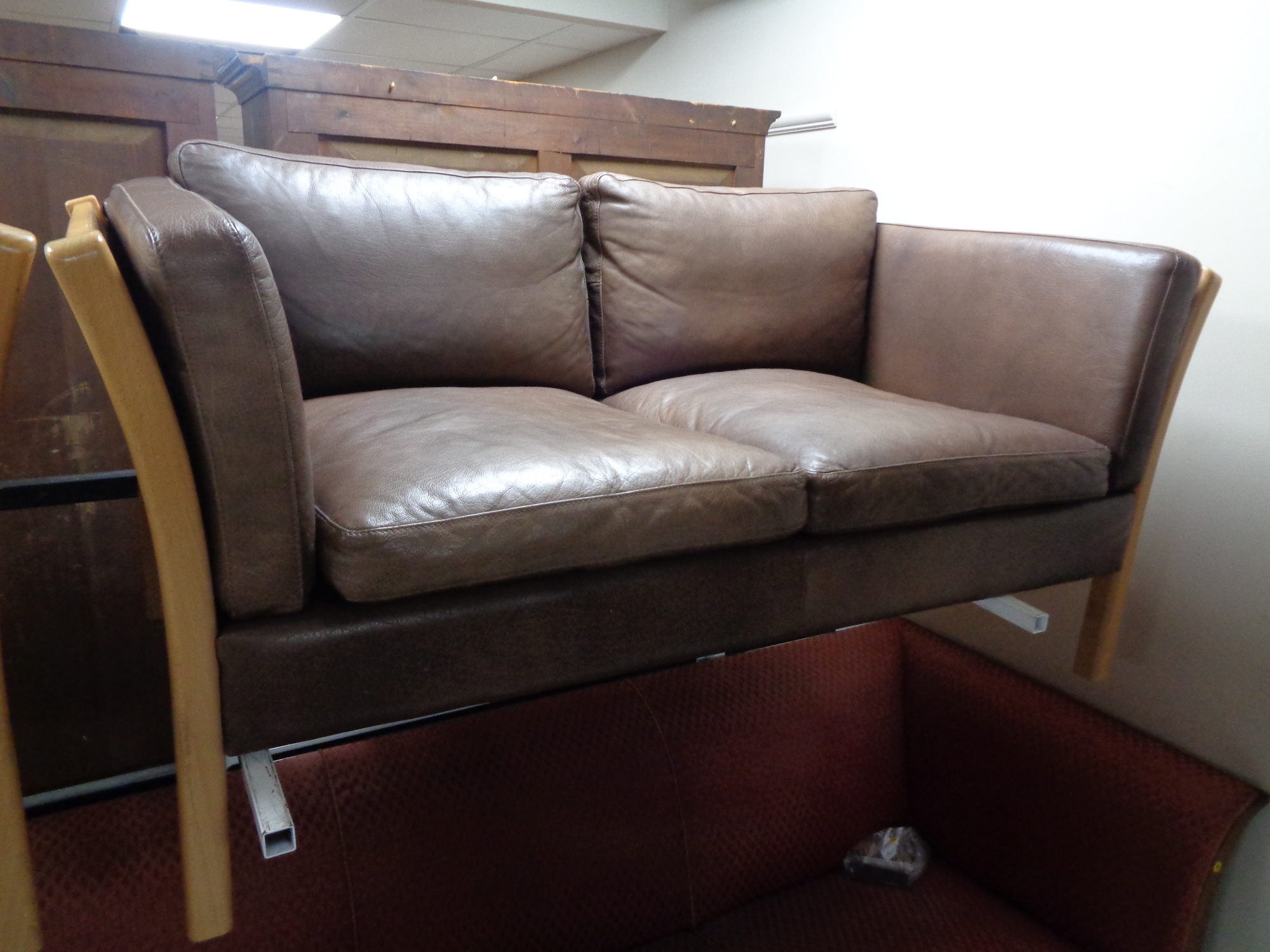 A 20th century Stouby wood framed brown leather three seater settee with matching two seater settee. - Image 3 of 3