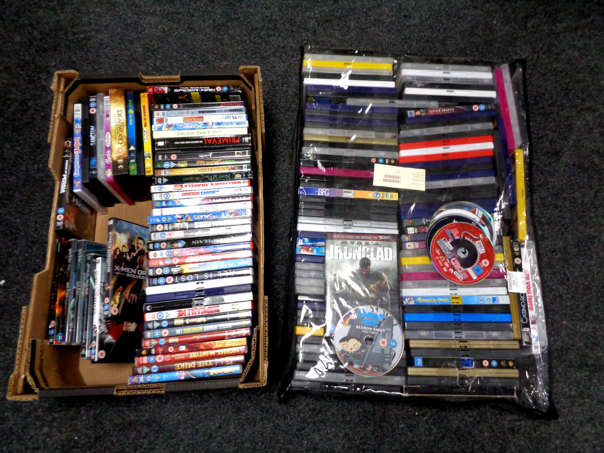 A storage bag and a box of assorted DVDs