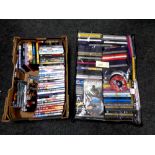 A storage bag and a box of assorted DVDs