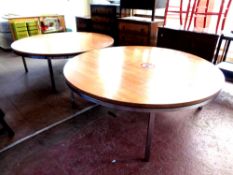 A pair of circular 20th century Danish oversized coffee tables on metal legs